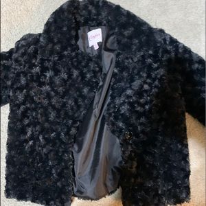 Candie’s black fur jacket